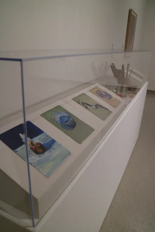 Fresno Art Museum — display case with small paintings and sculptural objects