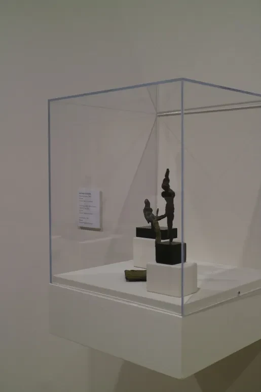 Fresno Art Museum — display case with two bronze figurative sculptures