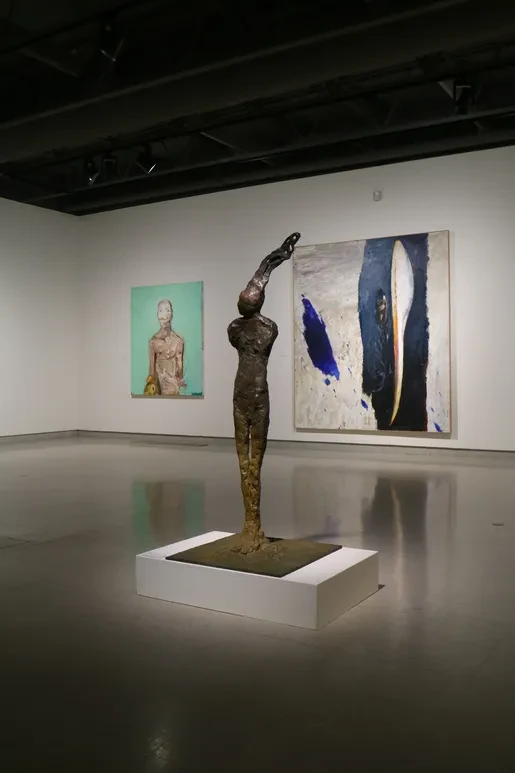 Fresno Art Museum — bronze figures with yellow and red canvases
