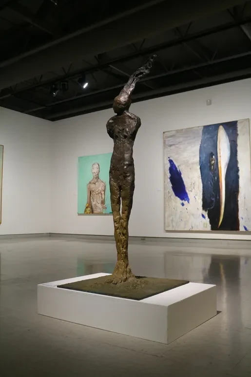 Fresno Art Museum — gallery entrance with bronze figure and portrait photograph