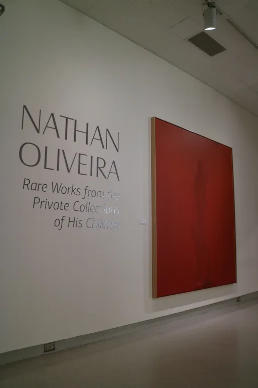Fresno Art Museum — gallery entrance wall with Nathan Oliveira exhibition title and large red canvas