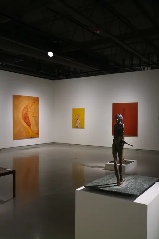 Fresno Art Museum — bronze figure leaning forward with large bird painting