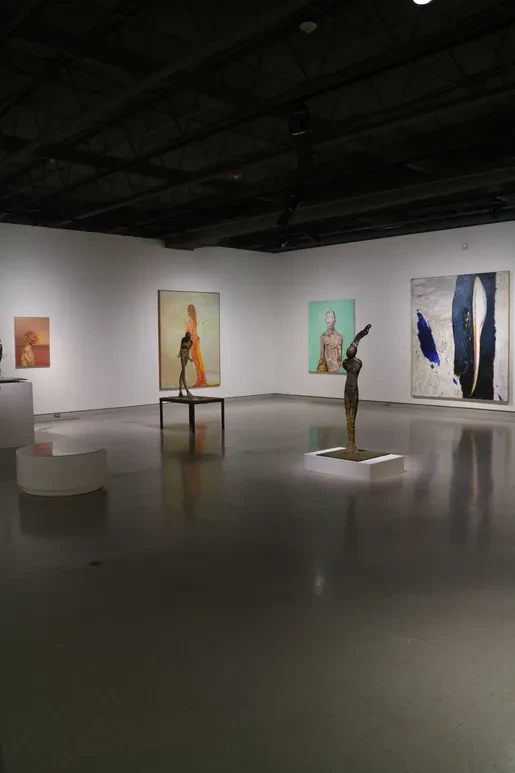 Fresno Art Museum — wide view with bronze figures and large colorful canvases