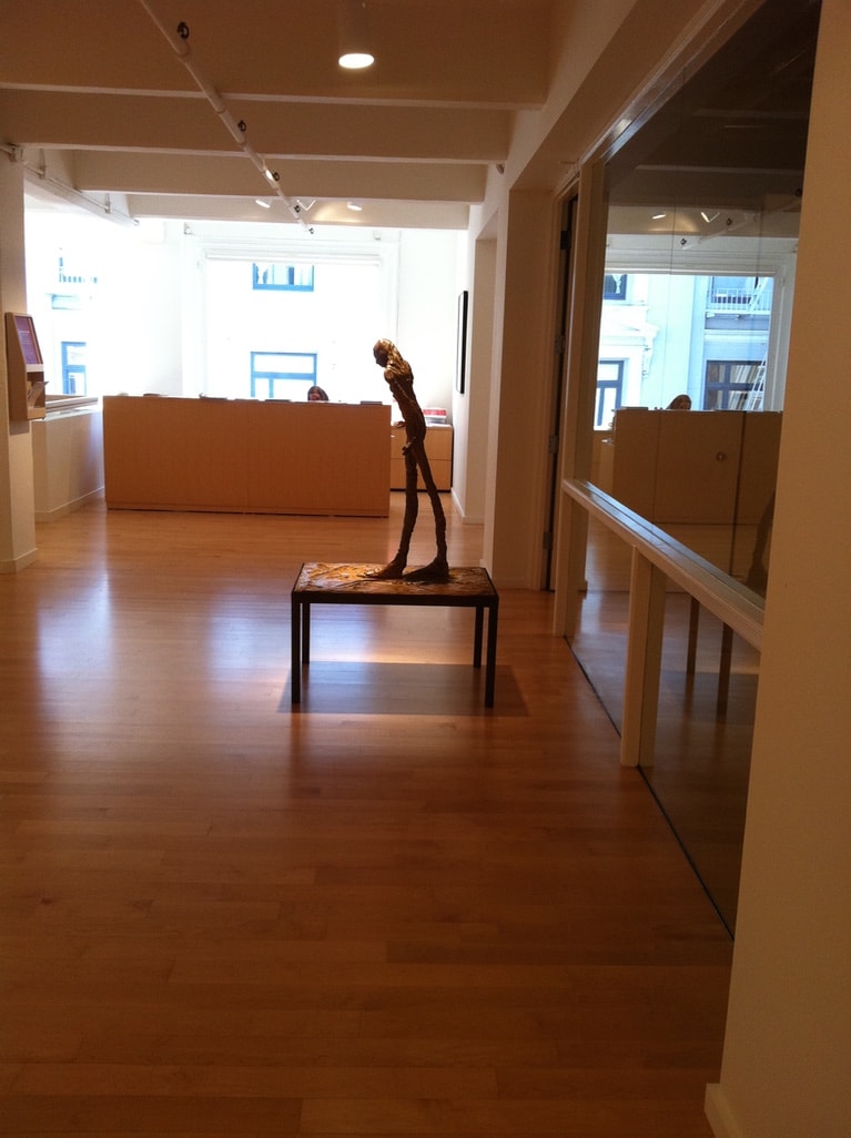 Berggruen Memorial Show — gallery entrance with bronze figure sculpture on table