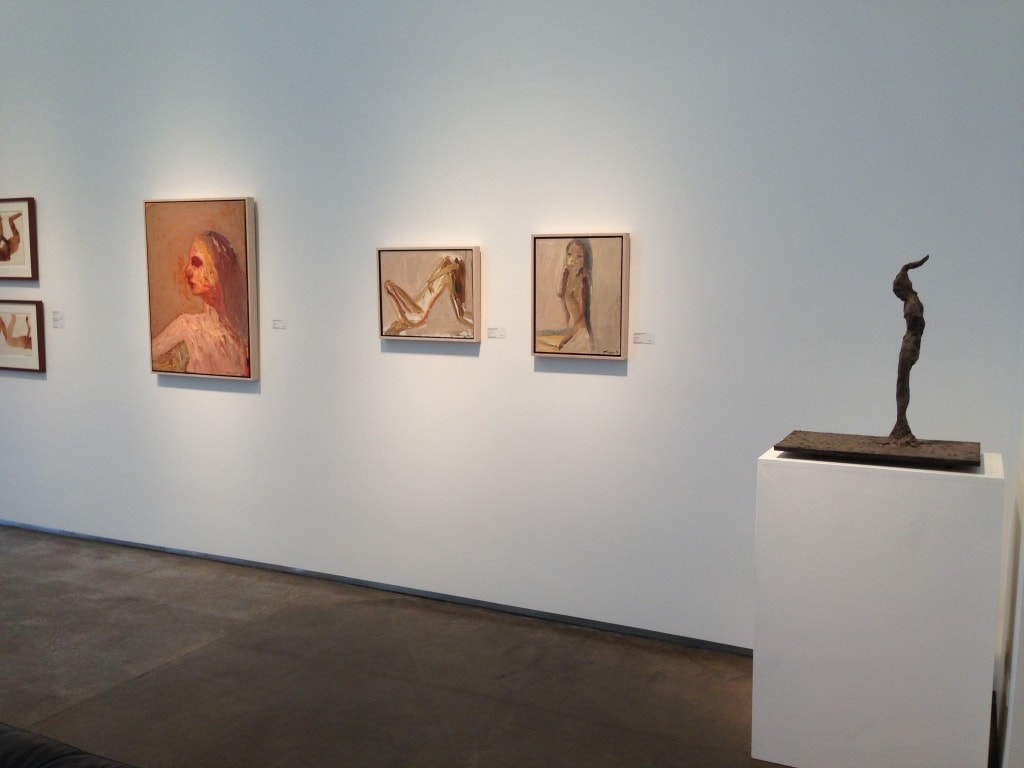 LewAllen Gallery — gallery wall with figurative paintings and small bronze sculpture on pedestal