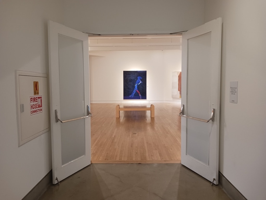Triton Museum of Art — wide gallery view with bronze figures and figurative paintings