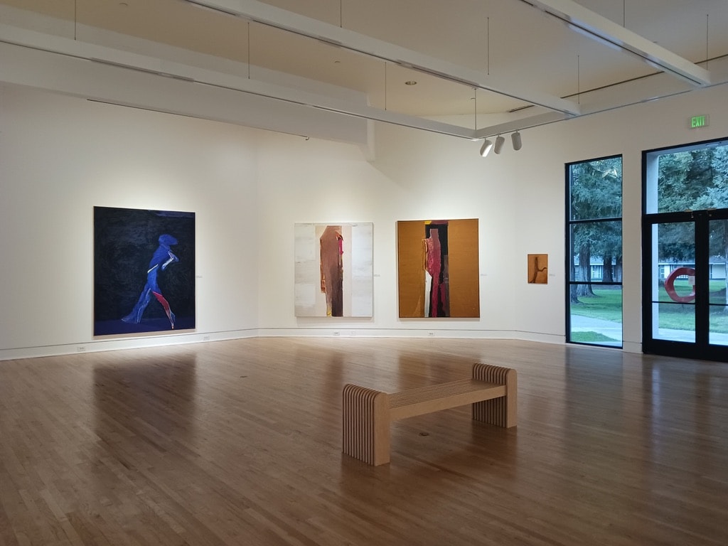 Triton Museum of Art — doorway view into gallery room with blue figurative painting